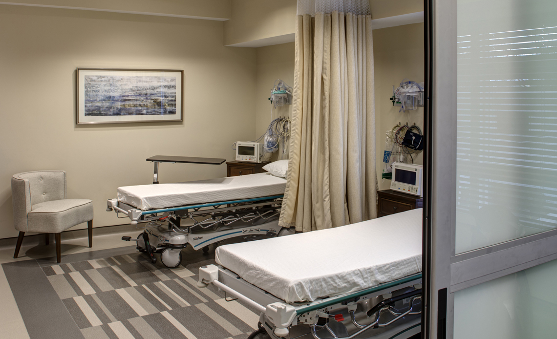 The private recovery suite, with curtained bays and monitoring at each bed