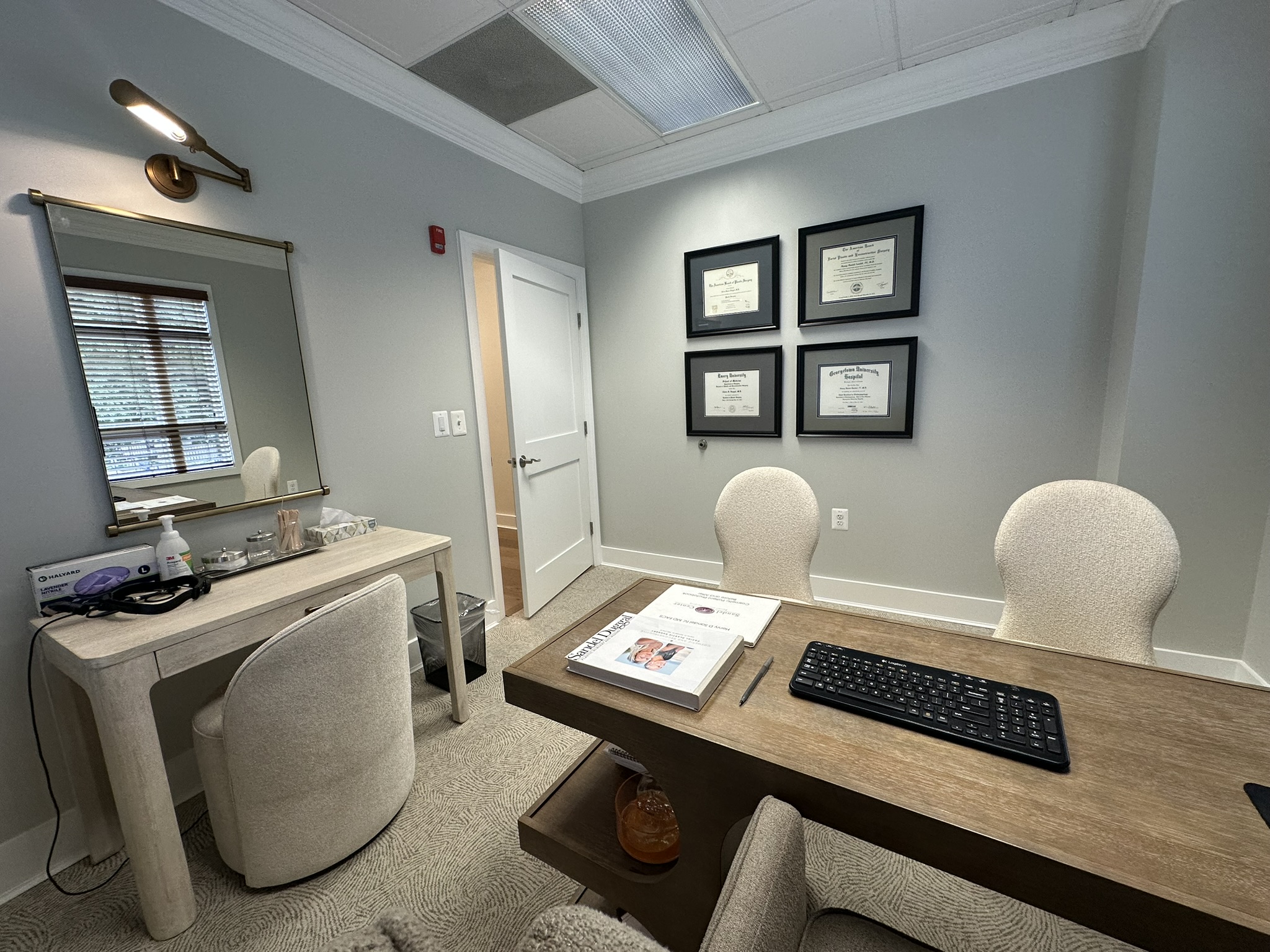 A consultation room with a screen for reviewing Vectra 3D imaging