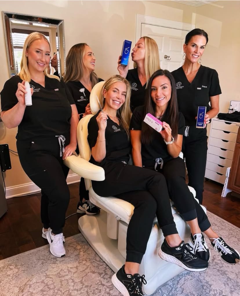 Medical spa team with SkinMedica and skincare products